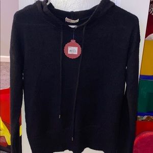 Cute black sweater and still has the tag on it